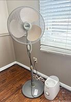 Front view of Clairion pedestal fan and Honeywell humidifier on floor