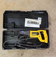 Reciprocating saw inside molded plastic case with manual
