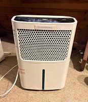 Front view of Garrison dehumidifier with power cord visible