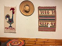 Group view of both tapestries, sombrero and mat