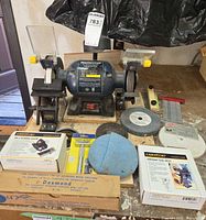 Full view of bench grinder with all accessories displayed