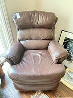 Front view of brown recliner chair