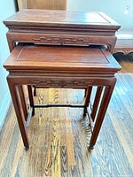 Front view of both nesting tables stacked