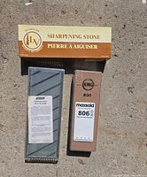 Two boxed stones: King 806 water stone package and grooved flattening stone in case, Lee Valley outer box visible