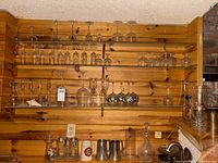 Overview of shelves showing stemware, steins, decanter