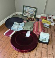 Full lot overview with charger plate stack, linens, placemats, coasters