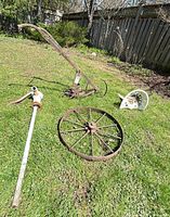All four vintage farm items laid out on grass