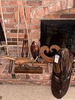 Group shot showing all carved wooden items on hearth