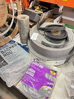 Group shot showing expansion joint roll, two backer rod bags, additional foam rolls