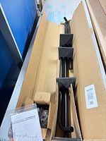 Entire boxed curtain rod set with instructions visible