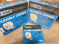 Group shot of two NO-COAT Flexible Corner 450 boxes and one 325 box