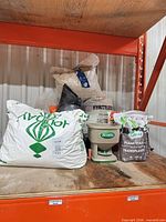 All items on shelf showing spreader and multiple bags