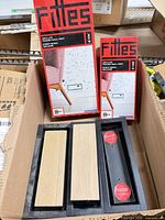 Box showing two packaged Fittes vents and three black vents