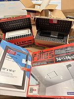 Boxed Fittes Aria Lite exhaust mount, Drywall Lite frame, and two framed vents visible