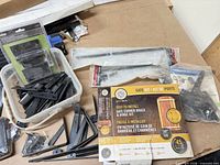 Boxed Nuvo Iron gate kit, loose black hardware, packaged cane bolts and latch visible