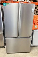 Full view of Hisense stainless French-door refrigerator with bottom freezer