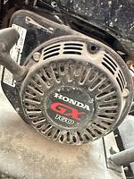 Close-up of Honda GX160 recoil starter on compactor
