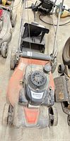 Top view of Husqvarna LC221RH mower showing deck, Honda GCV160 engine cover, pull cord, fuel cap