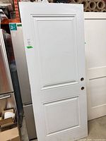 Front view of white 2-panel door slab