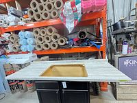 Top view of countertop showing sink cutout and faux wood grain surface