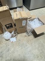 Three Matteo boxes, one opened Pentair box with bubble wrap