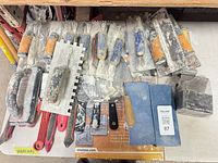 Top view of all masonry tools spread on table