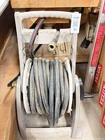 Front view of plastic hose reel with coiled hose