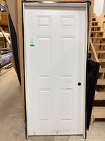 Front view of prehung six-panel door in frame