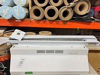 Nutone range hood front view with Stelpro heater placed on top