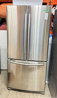 Full front view of stainless steel Samsung French door refrigerator with bottom freezer