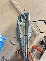 Full view of Sigma manual tile cutter showing rails, handle and base