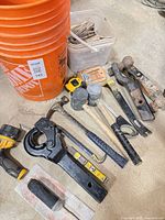 Full lot overview with hitch, drill, tools, buckets, hardware