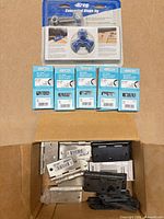 Packaged Kreg jig, five Onward hinge boxes, open box with loose hinges
