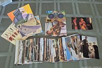 Spread of Indiana Jones Chronicles trading cards, folded cards, 3-D cards and goggles on table
