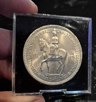 Obverse of 1953 5 shilling coin in holder