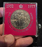 Obverse of 1977 Silver Jubilee crown showing Queen on horseback in presentation case