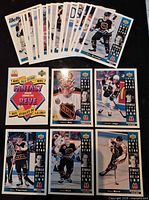 All 28 McDonald’s 1993-94 NHL All-Star cards fanned on surface showing title card and multiple player cards