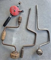 Overview of all hand-powered tools: eggbeater drill, two brace drills, auger bit