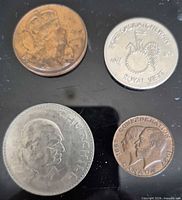 Obverse sides of four commemorative coins