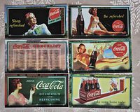 All six Coca-Cola billboard cards laid out for clear view of fronts