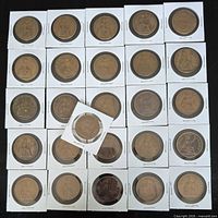 Fronts of 26 British large pennies in flips