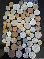 Top-down view of the 68 assorted European coins arranged in rows