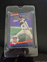 Front of oversized Nolan Ryan card inside clear hard case
