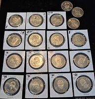 Group shot of all 18 NHLPA Hockey Greats coins, most in sleeves