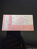Front of ticket showing game details, price, section number and Pat Falloon signature