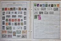 Two album pages showing numerous Nigerian stamps affixed