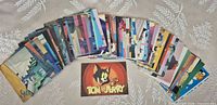 Spread of 59 Tom & Jerry trading cards, fronts visible along with title card
