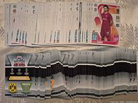 Spread of Topps Match Attax cards showing fronts and backs