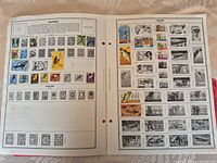 Two album pages with multiple Uganda stamps, colour left page, right page greyscale placeholders