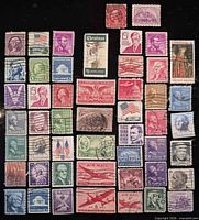 All 50 different cancelled U.S. postage stamps laid out in rows